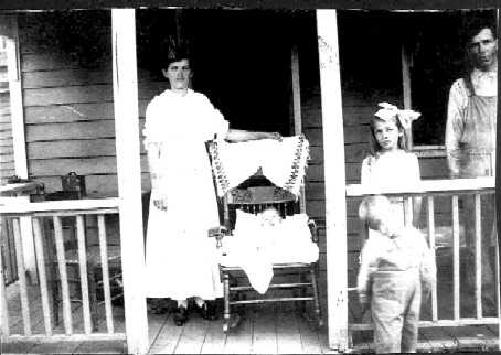 [Willie and Bessie are my Grandparents. The young boy standing is my Dad.]